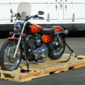 How do you prepare a motorcycle for transport?